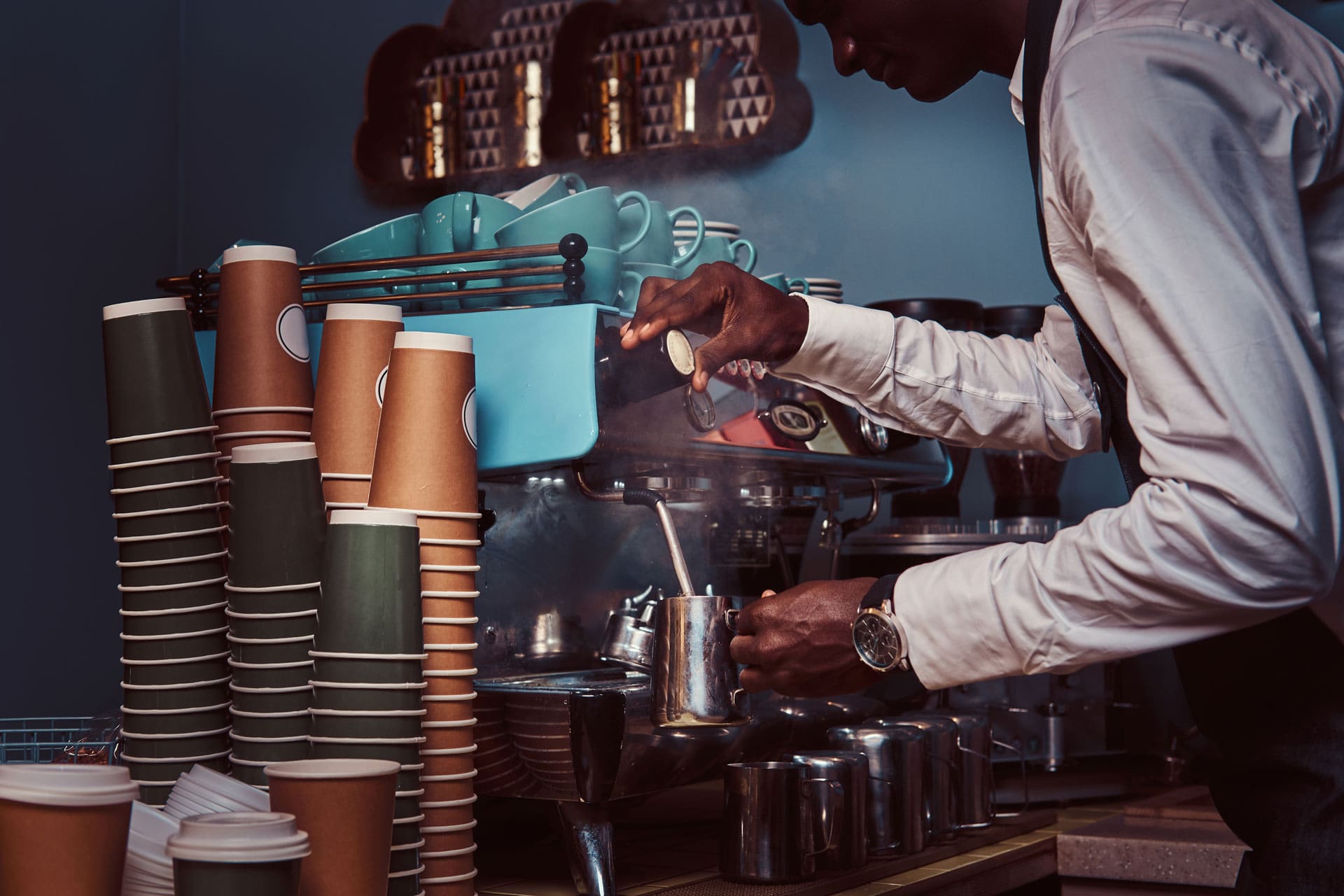 side-view-of-african-american-barista-in-white-shi-WNW3MKF-min